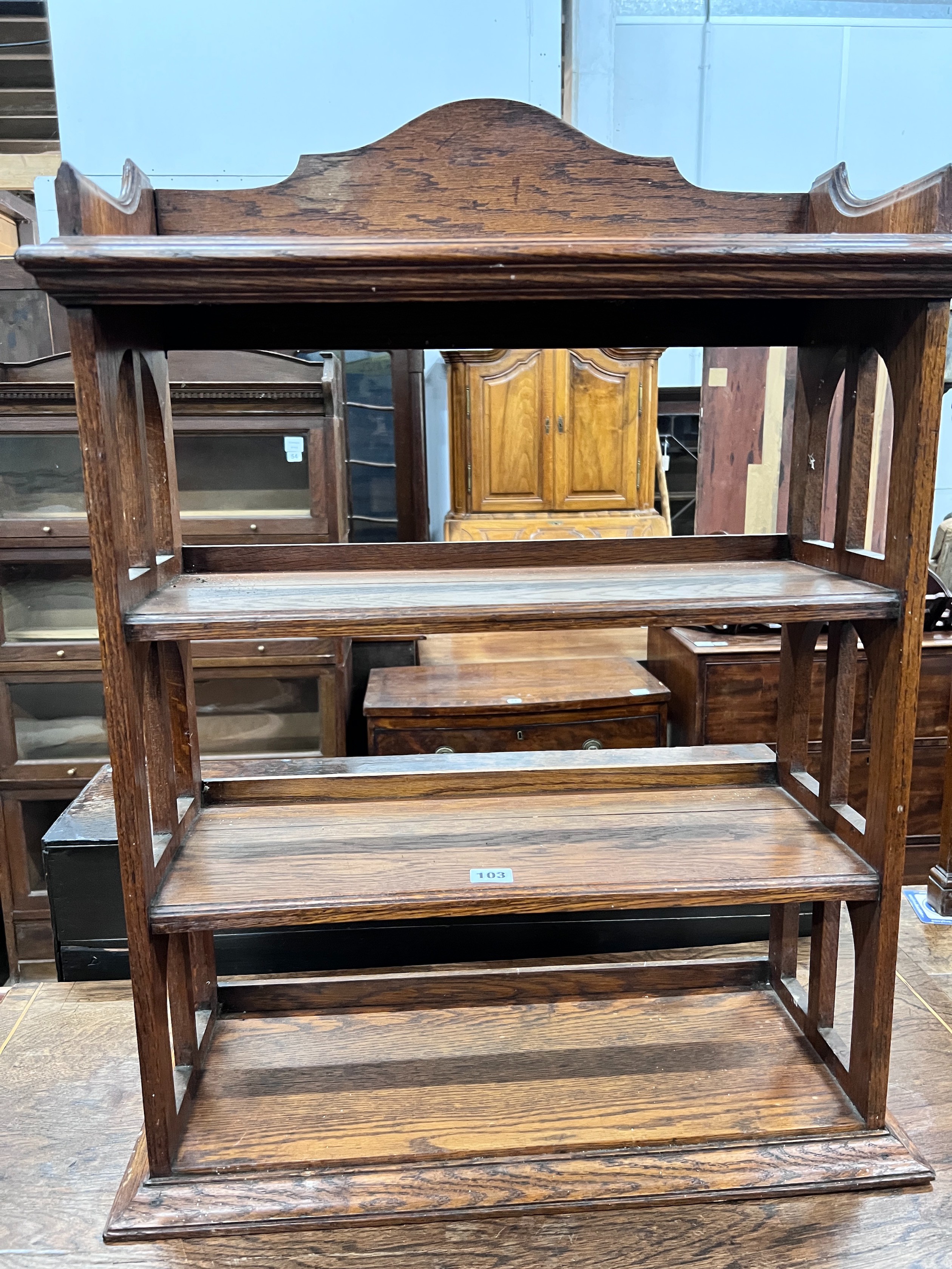 An Edwardian oak table top four tier open bookcase, width 62cm, depth 23cm, height 81cm *Please note the sale commences at 9am.